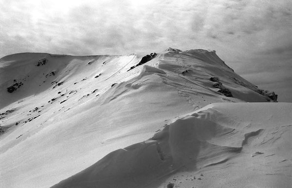 Patterned sky and crisp snow formations